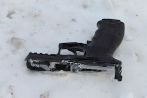 A broken Airsoft pistol lay in the snow on the railroad tracks at Griffing Avenue Saturday morning (RiverheadLOCAL photo by Denise Civiletti)