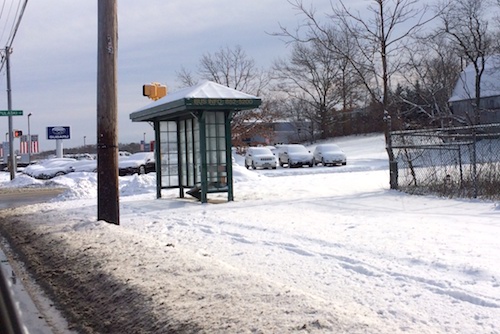 Bus shelter on CR58 at Pulaski Street in front of county-owned sump. (RiverheadLOCAL photo by Katie Blasl)