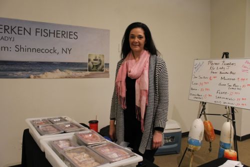 Meredith Daniell of family-owned and operated Merken Fisheries in Hampton Bays, with fresh-caught fish from local waters (including sea scallops just off the boat at 8 a.m.)