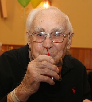 Tony Kolenski enjoyed a whiskey sour at his 100th birthday party.