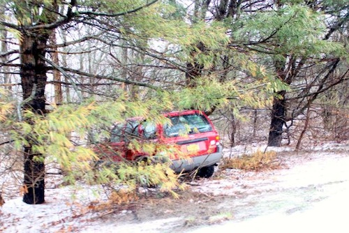 SUV skidded off the road on CR 015 near Hubbard Avenue. RiverheadLOCAL photo by Peter Blasl