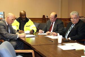 Highway Superintendent George Woodson at Thursday's town board work session with, from left, Riverhead financial administrator Bill Rothaar and councilmen James Wooten and John Dunleavy. (RiverheadLOCAL photo by Denise Civiletti)