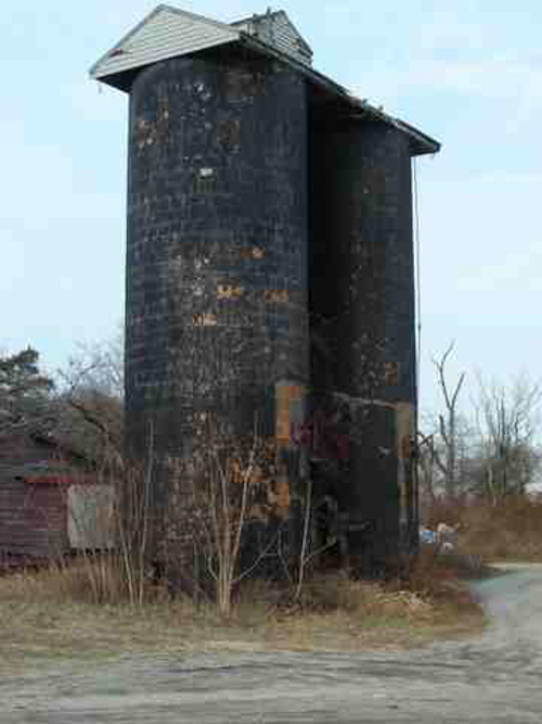 The distinctive black silos before deconstruction began Monday. Photo courtesy of Blake Corwin.