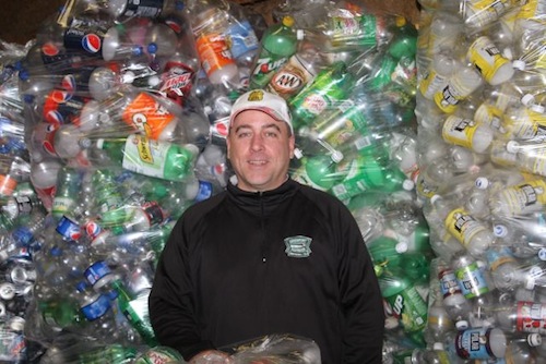 Kevin McKillop of Riverhead Beverage has made it easy for Hannah to redeem deposit cans and bottles. (RiverheadLOCAL photo by Peter Blasl)