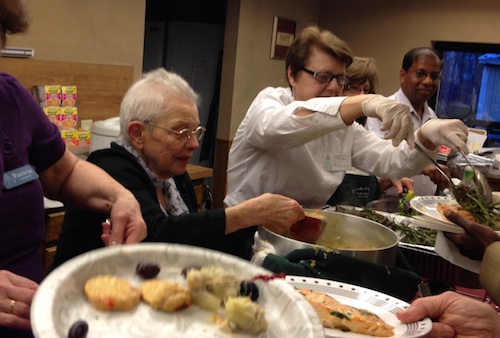 Seder foods being served buffet-style at the community Seder Sunday. (Photo by Eileen Benthal)