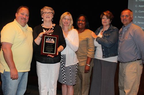 Retiring school board president Ann Cotten-DeGrasse was acknowledged by fellow board members at last week's meeting. Pictured, from left: board vice president Greg Meyer, Cotten-DeGrasse, Sue Koukounas, Kimberly Ligon, Amy Lantz and Christopher Dorr. 