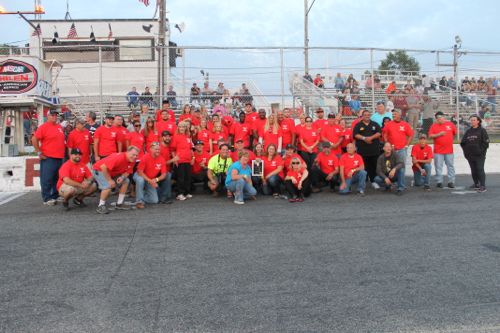 'Dynamite' Dan Turbush, kneeling front row center, with family, friends and supporters on the track Saturday night. (Photo: Peter Blasl)