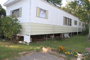 Unit 18, where squatters shot heroin and ripped off the aluminum skirting to sell for scrap. (Photo: Peter Blasl)