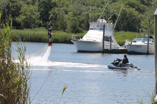 Flyboard LI instructor James Bissett IV giving instruction to a student on the Peconic River Aug. 14. (Photo: Denise Civiletti)