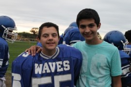 Derrick and his brother Brayden on the football field Friday. Brayden is sidelined with an injury.