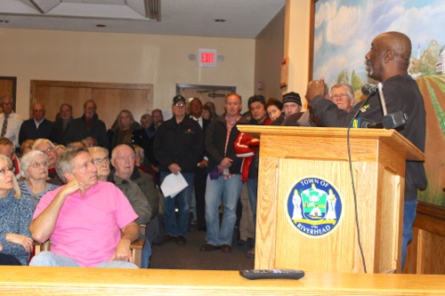 Highway Superintendent George Woodson addresses a packed meeting room on the subject of private road snow-plowing and maintenance Dec. 2, 2014. Photo: Denise Civiletti