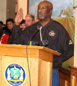 Riverhead Highway Superintendent George Woodson being sworn in at yesterday's town board hearing. 