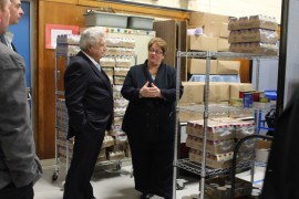 The food pantry has outgrown its home in the school's custodial closets; an area of the cafeteria is now sectioned off to store pantry foods. Photo: Katie Blasl