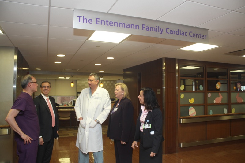 Dr. Larry Ong, left, head of North Shore-LIJ's cardiac catheterization, speaks with chief operating officer Mark Solazzo, chairman of cardiovascular and thoracic surgery Alan Hartman, Winnie Mack, eastern region excutive director WInnie Mack and Southside Hospital executive director Donna Moravick at Southside Hospital's Entenmann Family Cardiac Center on April 3. Photo: Peter Blasl