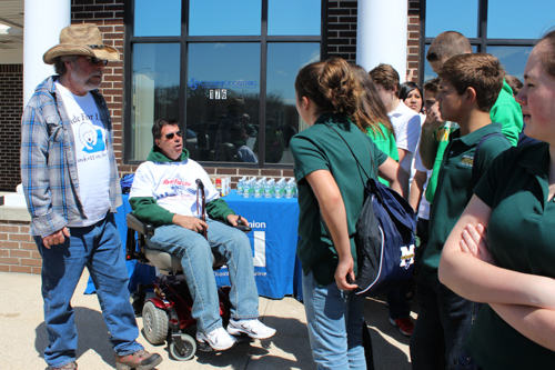 ALS victims Paul Weissman, left, and Frank Verdone, right, greet students from McGann-Mercy this morning. Photo: Katie Blasl.