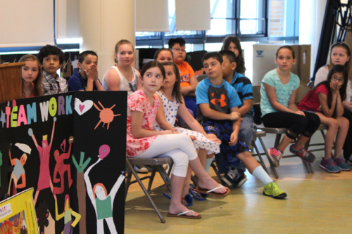 Riley Avenue fourth graders explained to the audience what they learned from working on the mural. Photo: Katie Blasl