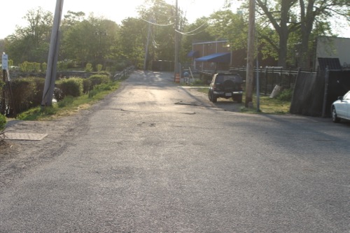Motorists use this driveway running along Grangebel Park and connecting with the LISC and Chase Bank parking lots, as a shortcut to avoid traffic and lights on Main Street, Peconic Crossing traffic engineer Walter Dunn said. Photo: Denise Civiletti