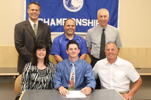 Nick Herzog, seated center, with his parents, Debbie and Scott, at a signing ceremony with (standing, L-R) RHS principal Charles Regan, baseball coach Robert Maccone and AD William Groth. Photo: Denise Civiletti