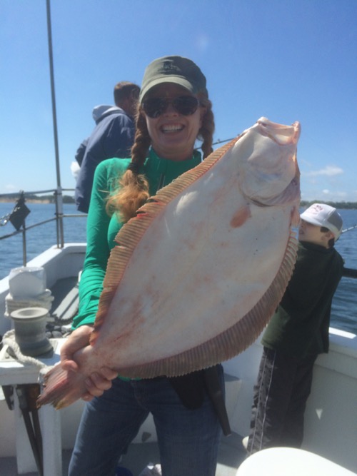 Jeannine Grynn with a nine-pound fluke caught on the Capt. Bob V. Courtesy photo: Jon Bowen