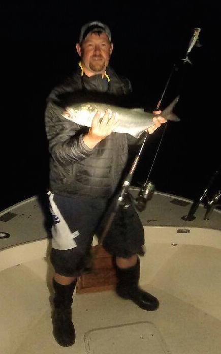Capt. Rob Thompson holding a bluefish caught on a Tsunami Paddle tail. Courtesy photo:Rob Thompson.
