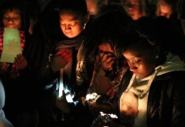 Residents gathered in Grangebel park for a candlelight vigil in February 2013, a week after the 21-year-old Riverhead man was gunned down in his home during a home invasion. File photo: Emil Breitenbach Jr.