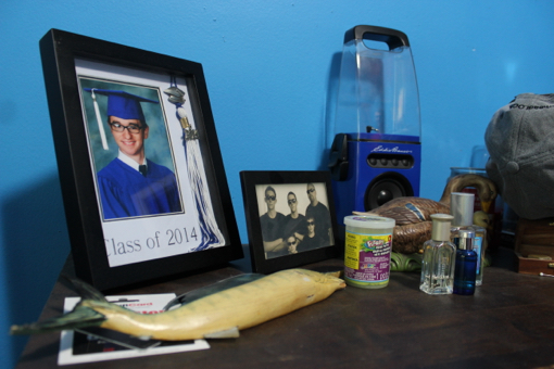 Spencer keeps his graduation photo on his bedroom dresser. Photo: Katie Blasl