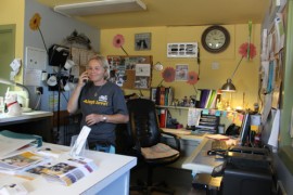 The main office has been repainted in bright colors, and photos of all the dogs in the shelter's care hang on a bulletin board. Photo: Katie Blasl