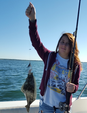Gia Forlenza with a fluke caught in Shinnecock Bay. Photo: Dominic Forlenza 