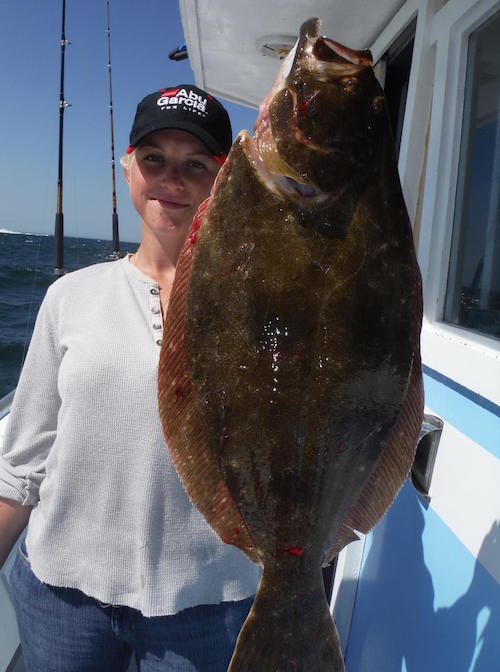Hannah with a fluke caught aboard the Brooklyn Girl.