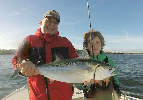 Tom and Brendan with a hefty false albacore caught with Capt. Rob Thompson last weekend. Courtesy photo: Rob Thompson 