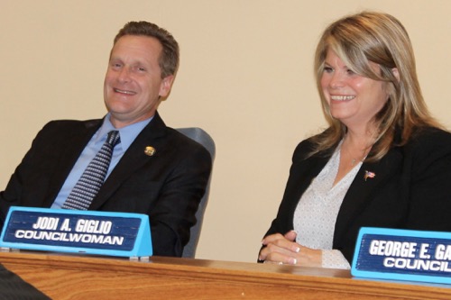 Supervisor Sean Walter and Councilwoman Jodi Giglio, who just concluded a bitterly fought election campaign, were all smiles at last night's town board meeting. Photo: Denise Civiletti