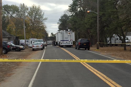 A portion of Old Quogue Road remained closed off as police investigate the crime scene this morning.Photo: Peter Blasl