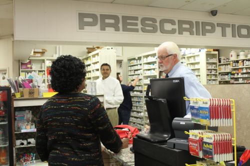 Barth waits on lifelong customer Marilyn Ross of Riverhead yesterday. Photo: Peter Blasl